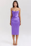 Woman wearing a strapless purple satin midi dress with a cowl neckline and ruched detailing.