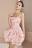 woman wearing a pink strapless ruched mini dress with a tiered ruffle bubble hem skirt