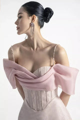 Close-up of the bodice and neckline of a pink formal mini dress