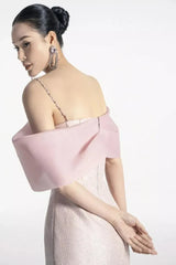 Back view of a woman wearing a pink formal mini dress