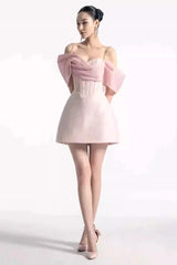 Full length view of a woman in a pink formal mini dress