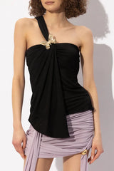 Black one-shoulder draped top with butterfly detail worn by a model