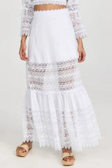 Close-up of the white lace maxi skirt, highlighting the tiered design and lace inserts.