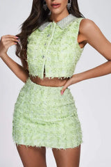 Model wearing a lime green textured tweed crop top and mini skirt set with embellished collar.