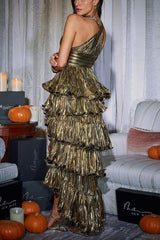 Back view of a woman in a gold metallic tiered ruffle halter dress.