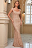 woman in a rose gold sequined floor-length gown with cap sleeves and sweetheart neckline