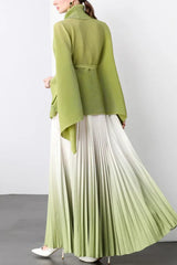 Back view of a model wearing a lime green wrap top and white to lime green ombre pleated maxi skirt.
