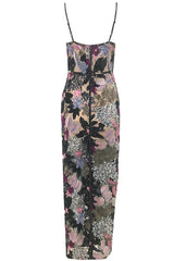 Close-up front view of a floor-length sequined gown with floral appliqués and sheer fabric.