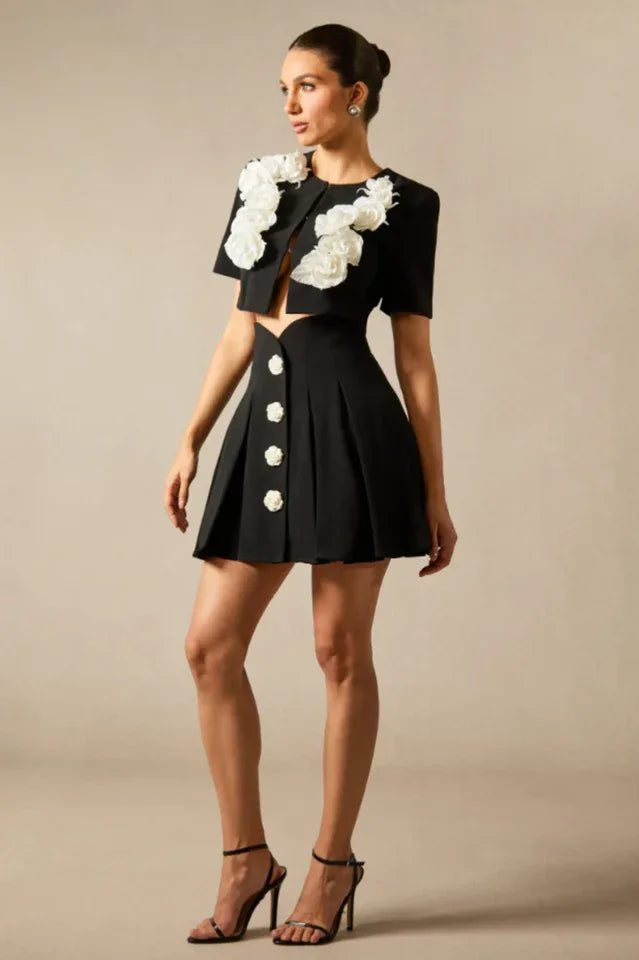 Another side view of the black floral embellished two-piece outfit.