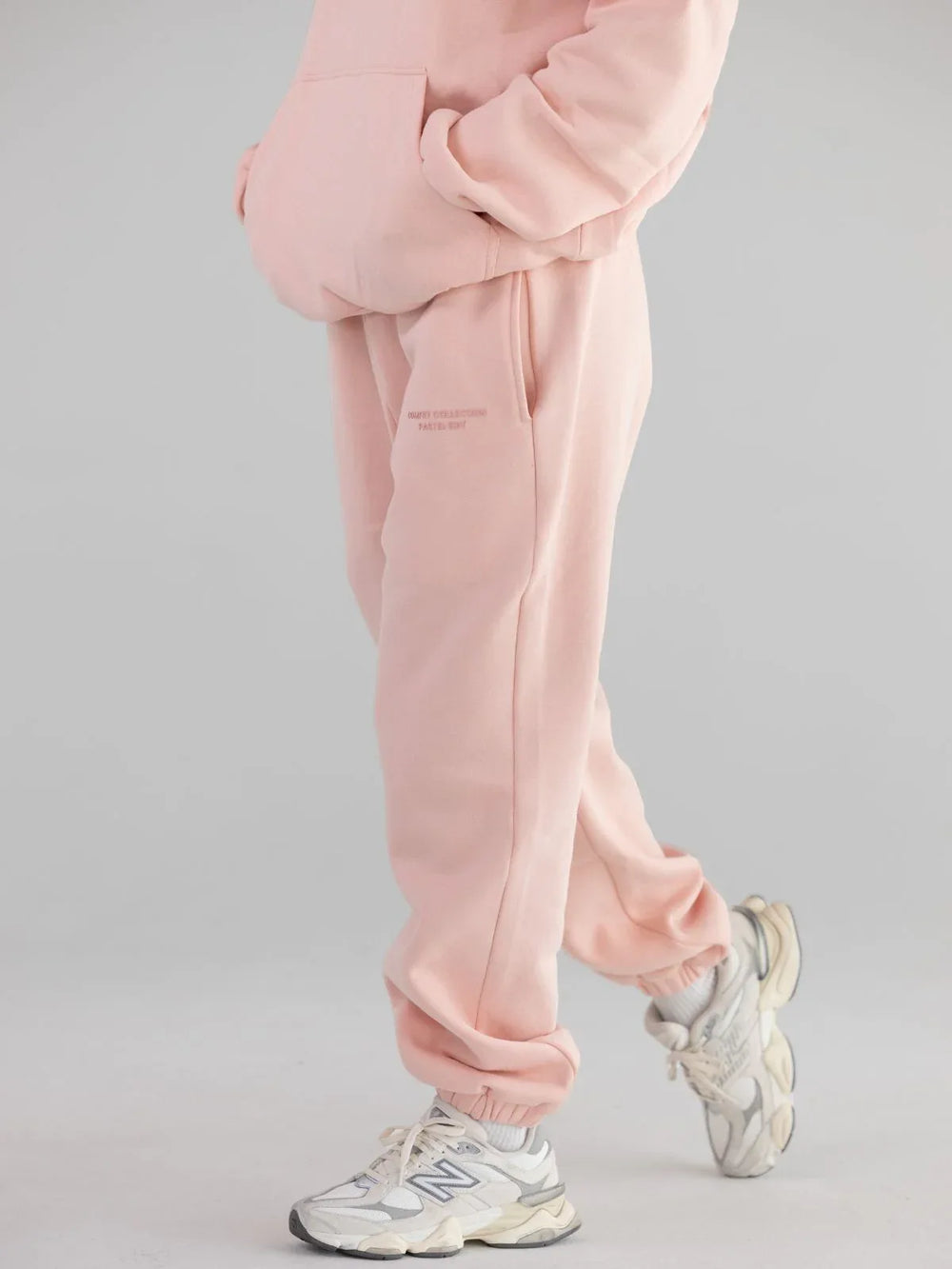 Model wearing light pink sweatpants