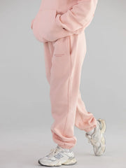 Model wearing light pink sweatpants