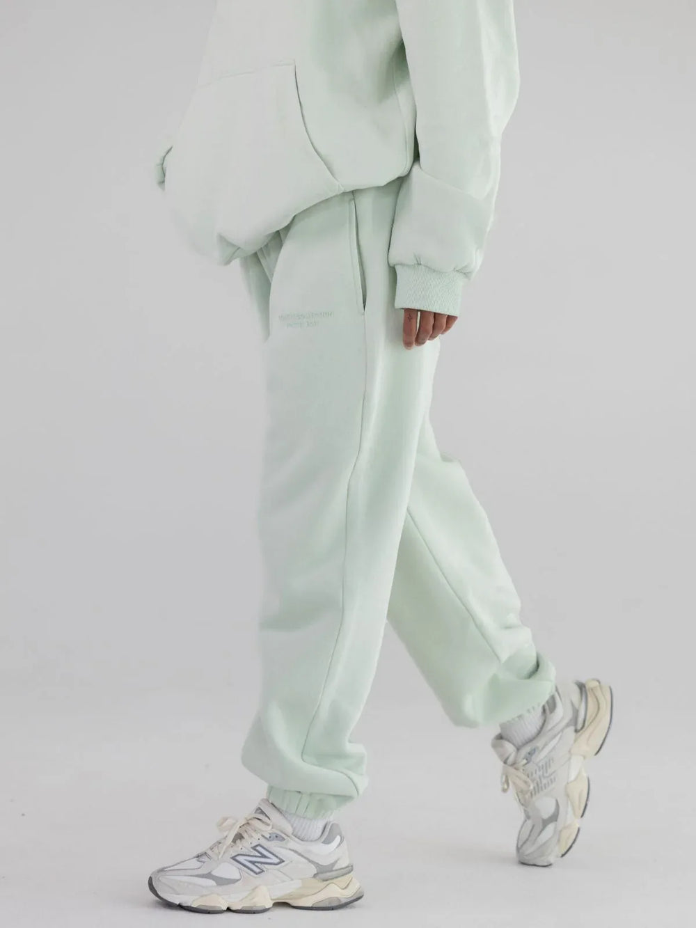 Model wearing mint green sweatpants