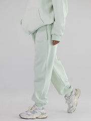 Model wearing mint green sweatpants