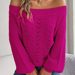 Woman wearing a fuchsia off-the-shoulder knit sweater with an open-knit pattern and long sleeves.