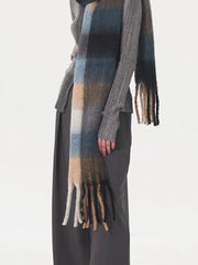 Close-up of a model's hand and scarf