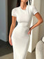 Woman wearing a white short-sleeve midi bodycon dress