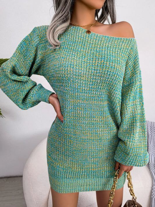 Woman wearing a green and yellow marled knit off-the-shoulder mini dress with long balloon sleeves, accessorized with a gold necklace and a brown chain-strap handbag.