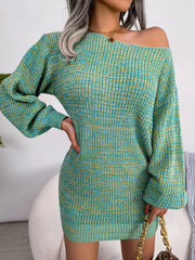 Woman wearing a green and yellow marled knit off-the-shoulder mini dress with long balloon sleeves, accessorized with a gold necklace and a brown chain-strap handbag.