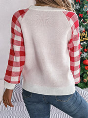Back view of a woman wearing a white and red reindeer graphic knit sweater with gingham plaid sleeves.
