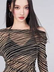 Close-up of the sheer striped fabric and off-the-shoulder neckline