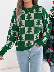 Woman posing in a green and white checkered Christmas tree sweater