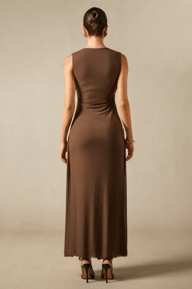 Back view of a brown sleeveless maxi dress with a simple and elegant design.