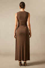 Back view of a brown sleeveless maxi dress with a simple and elegant design.