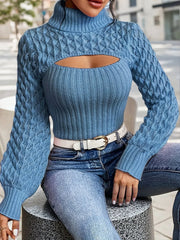 Close-up front view of a woman wearing a blue knit turtleneck top with a cut-out detail and balloon sleeves.