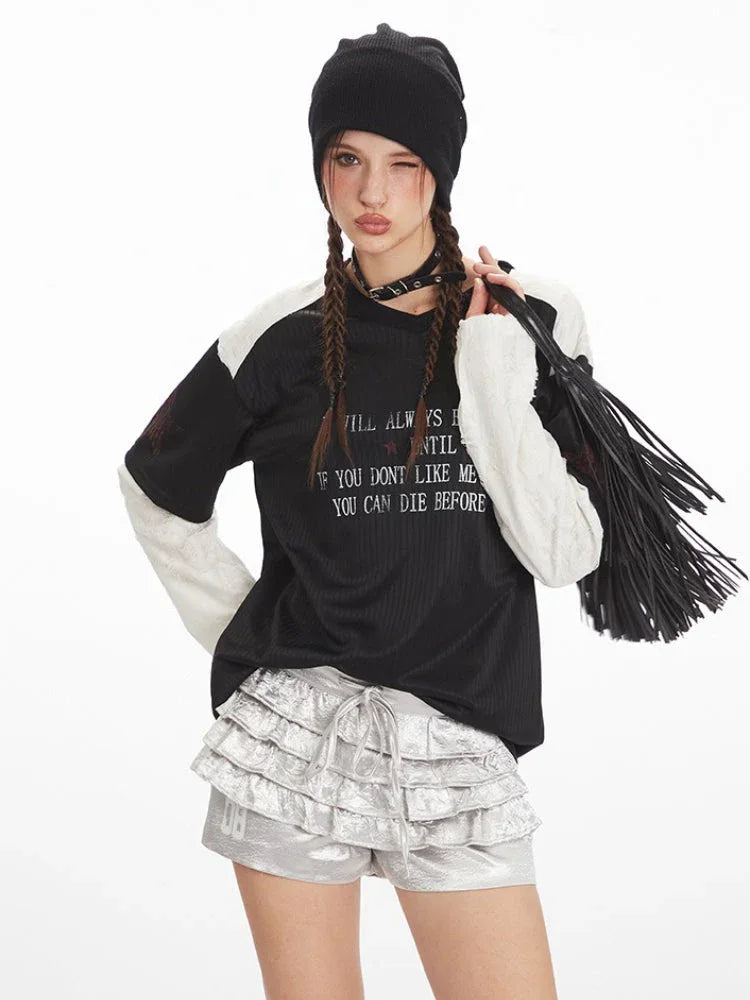 Close-up of the outfit, focusing on the layered shirt, ruffled shorts, and accessories, with the person winking.