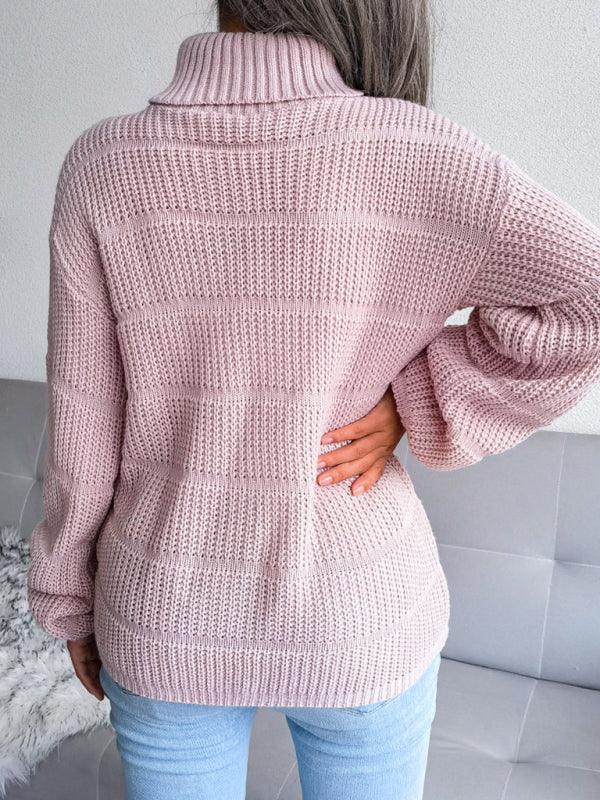 Back view of a woman wearing a pink knit turtleneck sweater with light blue jeans.