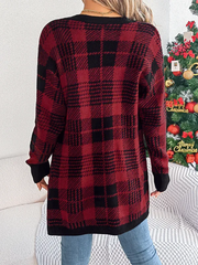 Back view of a woman in a red and black plaid longline knit cardigan.