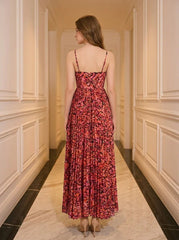 Back view of a woman in a red floral print maxi dress