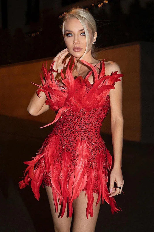 Woman wearing a red sequined mini dress with feather accents