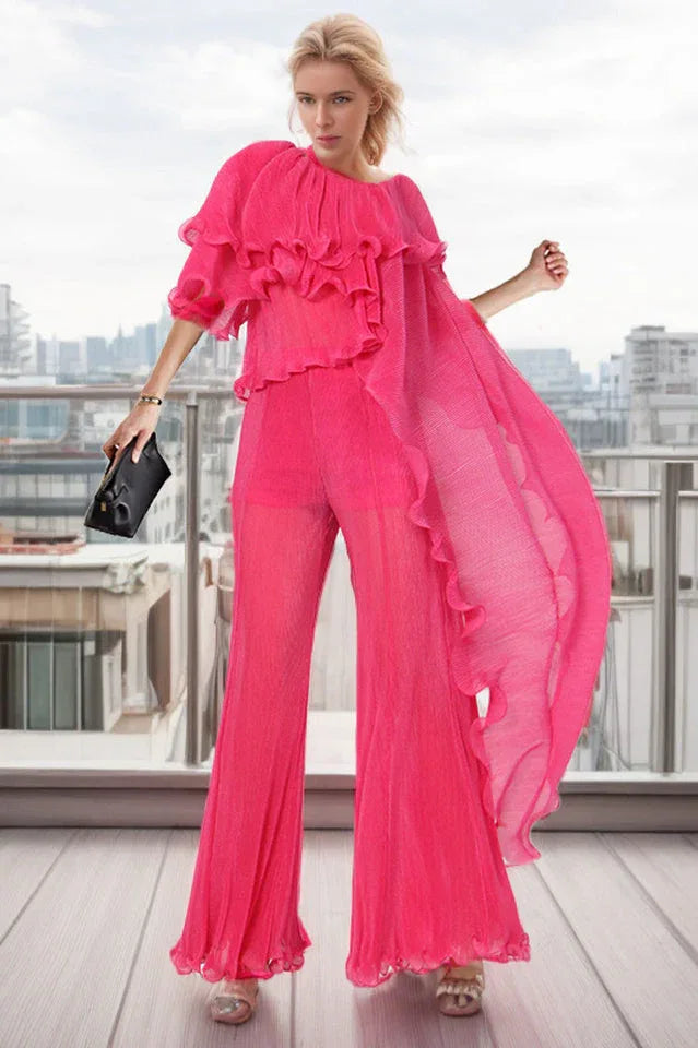 woman wearing a pink pleated ruffled top and wide-leg pants Main image