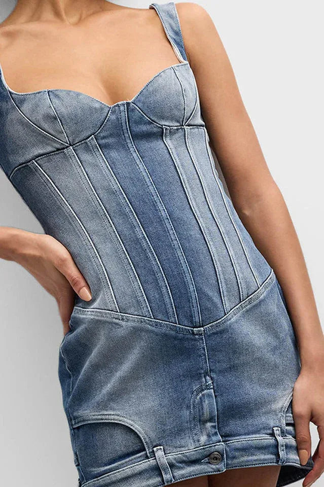 Detail shot of the blue denim corset mini dress, highlighting the texture and stitching.