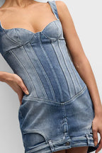 Detail shot of the blue denim corset mini dress, highlighting the texture and stitching.