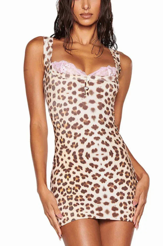 Close-up of a leopard print mini dress with pink lace trim Main image