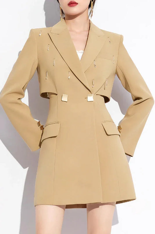 Front view of a tan double-breasted blazer dress with cut-out waist and flap pockets.