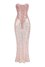 Pink sequined strapless gown with a sheer overlay.