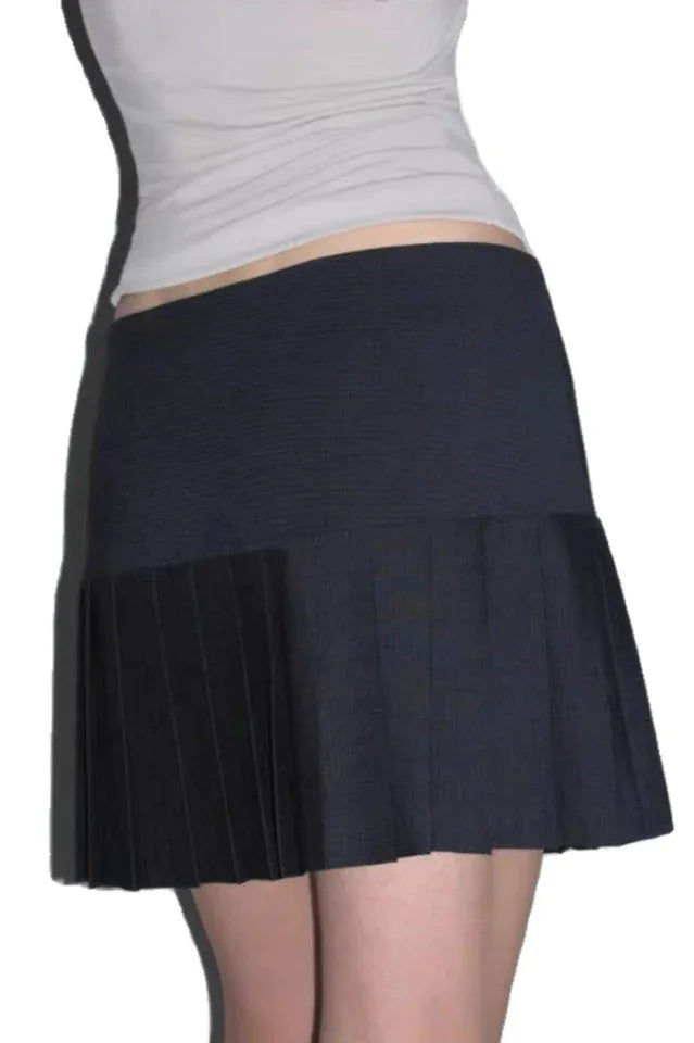 Side view of a black pleated mini skirt with a textured waistband.