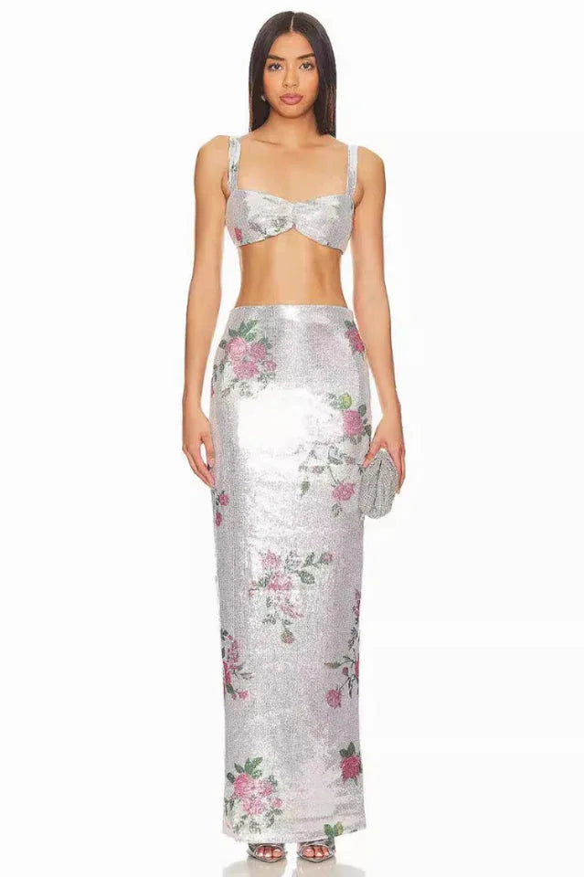 Full-length front view of a woman wearing a silver sequined maxi skirt with a floral print. Main image