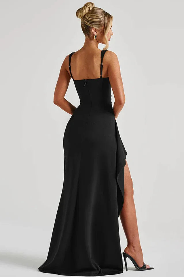 Back view of a woman in a black evening gown with a zipper closure