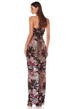 Back view of a strapless, sequined floral gown. The dress has a center back zipper and a long, fitted silhouette.