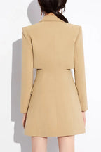 Back view of a tan double-breasted blazer dress with a cropped jacket effect.