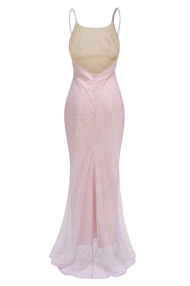 A sparkling lavender floor-length gown with a cowl neckline and spaghetti straps, back studio shot.