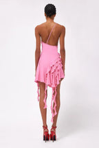 back view of a woman wearing a pink one-shoulder mini dress with ruffled asymmetrical hemline