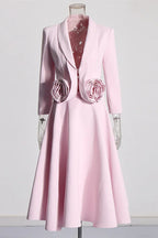 Pink blazer and skirt set with rose embellishments displayed on a mannequin