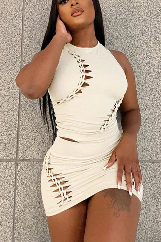 Woman wearing a cream knit bodycon dress with cut-out and lace-up details Main image