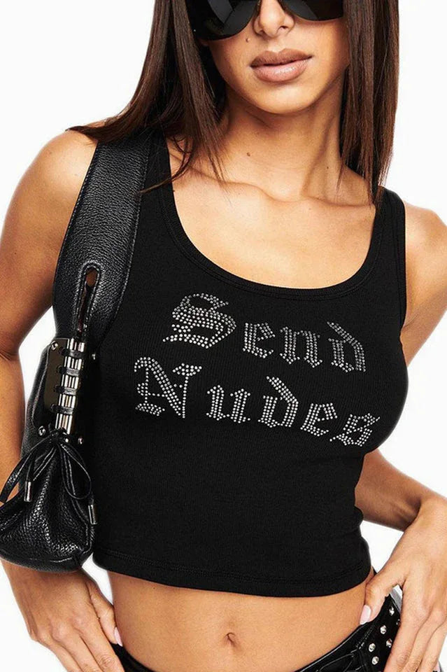 Woman wearing a black ribbed knit tank top with rhinestone "Send Nudes" graphic and a black purse Main image