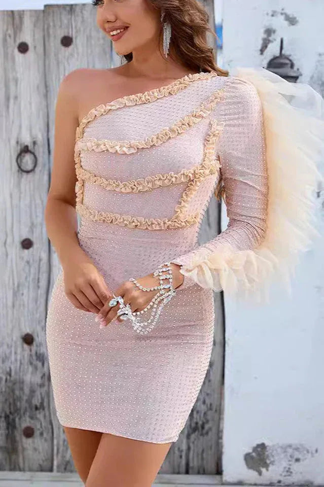 Back view of a woman wearing a shimmering bodycon mini dress.